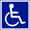 Bild: Weißer Rollstuhl auf blauem Grund